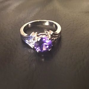 Amethyst colored center stone ring